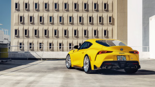 Yellow sports car building windowed - side profile free wallpaper for desktop