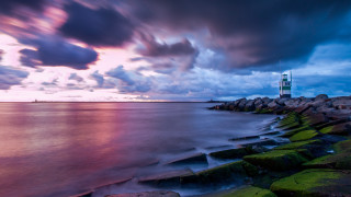 Lighthouse rocky shore mystical sky - rock and grass free wallpaper