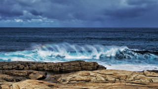 Wave crashing ocean cloudy rainbow - a large wave free wallpaper