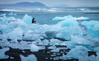 Man beach ice chunks mountains - adobe lightroom free wallpaper
