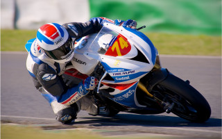 Motorcycle race track helmet blurry - ray free wallpaper