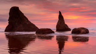 Sunset beach rocks pink sky - a sunset view of a beach free wallpaper