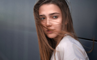 Woman longhair wind blown portrait - head and shoulders portrait free wallpaper