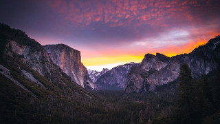 Mountain range sunset clouds forest 4 - a forest below free wallpaper