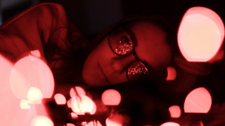Woman glasses laying hologram lights - many light free wallpaper