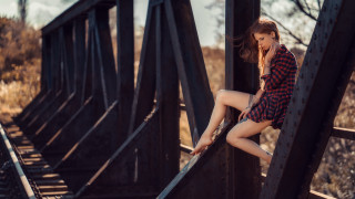 Woman leaning bridge cellphone autumn - a bridge over water free wallpaper