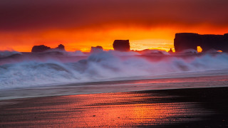 Sunset beach waves rocks ocean 2 - a sunset view of a beach free wallpaper