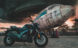 Motorcycle airplane stormcloud city matte - retrofuturism free wallpaper