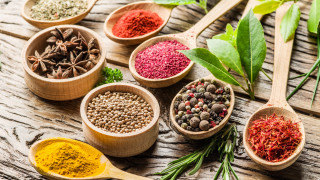 Spices wooden spoons herbs leaves - a wooden surface free wallpaper