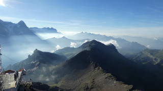 Mountain range clouds buildings people - the top of it free wallpaper