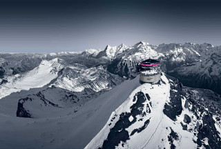 Snowboarder jumping snowy mountain peak - free winter wallpaper for desktop