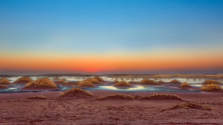 Beach sand mounds sunset blue - a blue sky and water free wallpaper