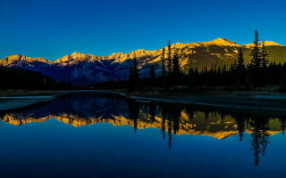 Mountain range reflection sunset forest 2 - a forest in the foreground free wallpaper