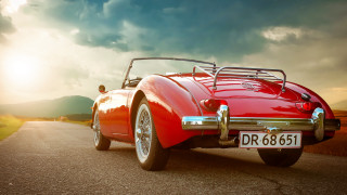 Red sports car cloudy sky 13 - a road under a cloudy sky free wallpaper