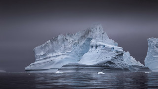 Iceberg ocean dark sky mountains - an iceberg free wallpaper