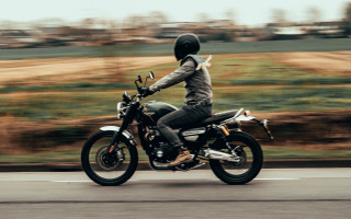 Motorcycle rider tiltshift motionblur field - motion blur free wallpaper