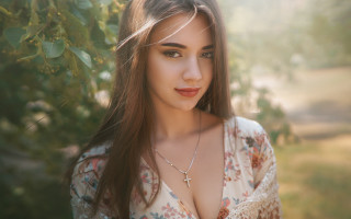 Elina karimova cross necklace outdoor - a sunbeam in the background free wallpaper