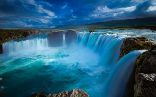 Waterfall blue sky clouds nature - a waterfall in the middle of the picture free wallpaper