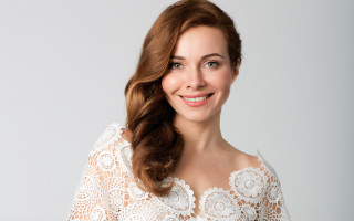 Smiling woman white lace top - head and shoulders portrait free wallpaper