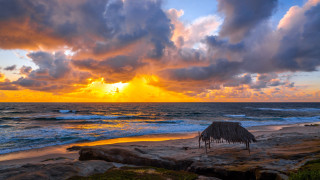 Beach hut sunset clouds water - a hut free wallpaper