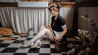 Woman sitting checkered floor broom - a broom free wallpaper