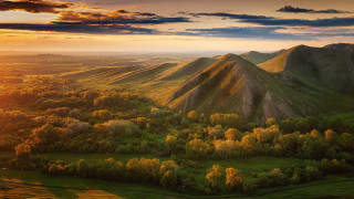 Mountain range forest sunset clouds 3 - the foreground and a sunset in the background free wallpaper