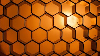 Hexagon mosaic backlighting brick wall - a close up of a wall free wallpaper