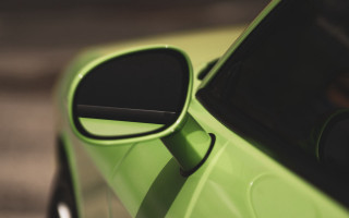Green car side mirror reflection - a green car free wallpaper