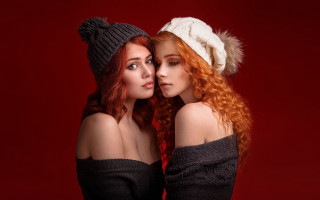 Winter hats two young women - a picture together in front free wallpaper