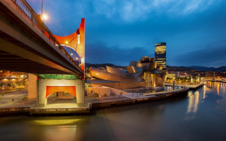 Bridge cityscape night lit mountains - modernism free wallpaper