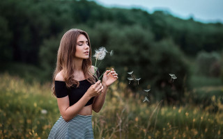 Dandelion blowing woman nature outdoors - the background and a sky free wallpaper