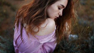 Freckled woman in field phone - her phone free wallpaper