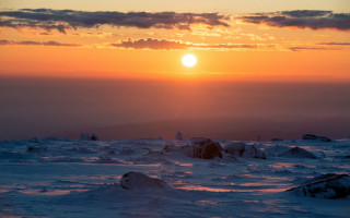 Sunset snowy mountain skier distant - ski free wallpaper