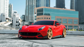 Red sports car cityscape bridge - skyscraper free wallpaper