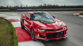 Red chevrolet camaro driving track - a sunbeam free wallpaper