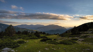 Grassy field mountains sunset clouds 2 - edi rama free wallpaper for desktop