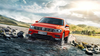 Red volkswagen suv river rocks - rock and grass free wallpaper