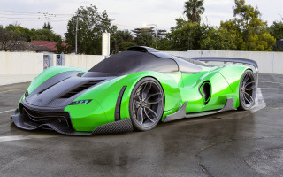 Green black sports car parking - a white fence free wallpaper