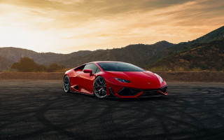 Red sports car mountains sunset - a parking lot free wallpaper