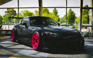 Black car red rims parking - fine art free wallpaper