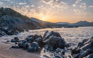 Beach rocks water sunset clouds 4 - avgust černigoj free wallpaper