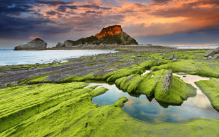 Green beach rock formation sunset - beautiful scenery free wallpaper