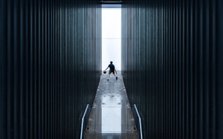 Man walking hallway suitcases window - david diao free wallpaper