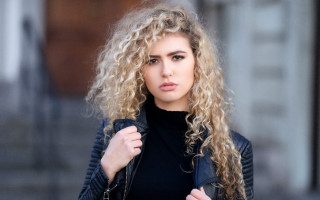 Woman curly hair jacket portrait - curly free wallpaper
