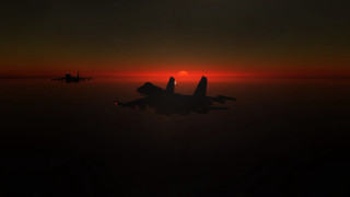 Jet fighter sunset ocean silhouette - a jet free wallpaper