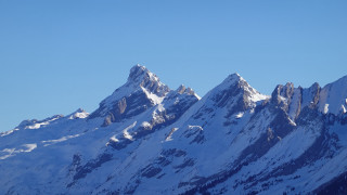 Mountain range snowy peak plane - a clear blue sky above free wallpaper