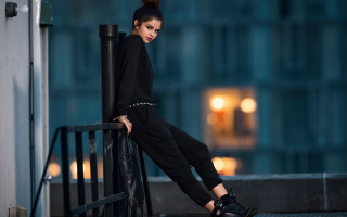 Woman leaning railing black pants - catrin g grosse free wallpaper