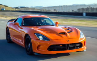 Orange sports car driving road 2 - a orange sports car free wallpaper