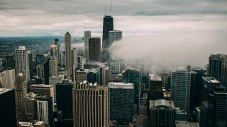 Cityscape skyscrapers clouds bridge architecture - a cityscape free wallpaper