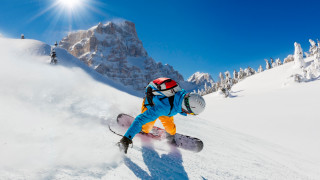 Snowboard rider mountains sunny scenery - a snowboard free wallpaper